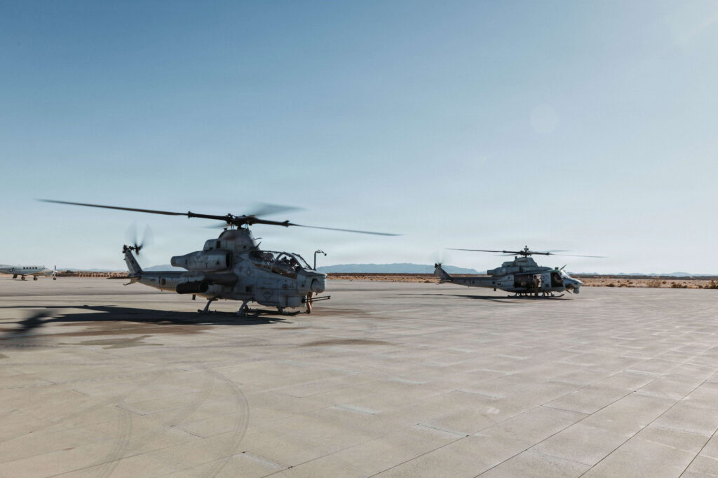 U.S. Marines with Marine Light Attack Helicopter Squadron (HMLA) 267, Marine Aircraft Group 39, 3rd Marine Aircraft Wing, conduct shutdown procedures for the AH-1Z Viper and an UH-1Y Venom during Steel Knight 25 at Marine Corps Air Ground Combat Center. Photo by Lance Cpl. Parker Peichel